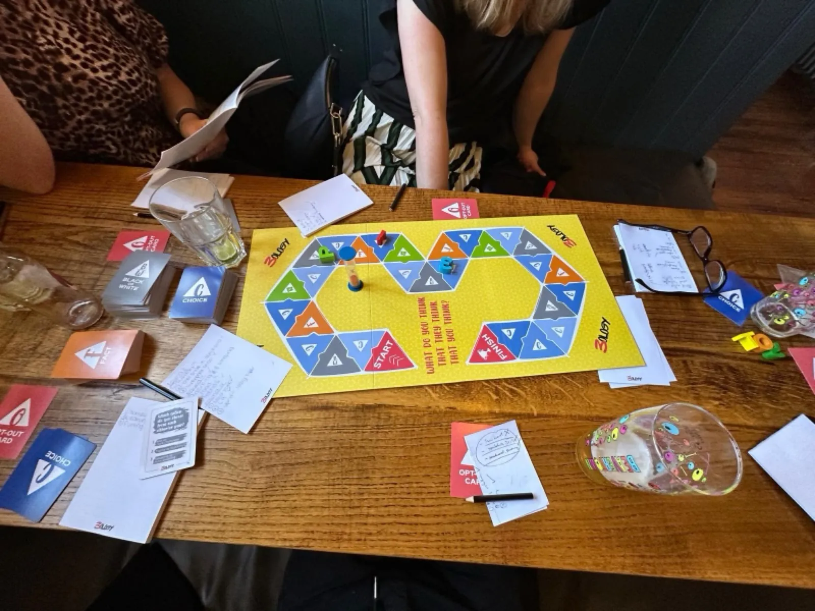 A game of 3ology in full swing around the table